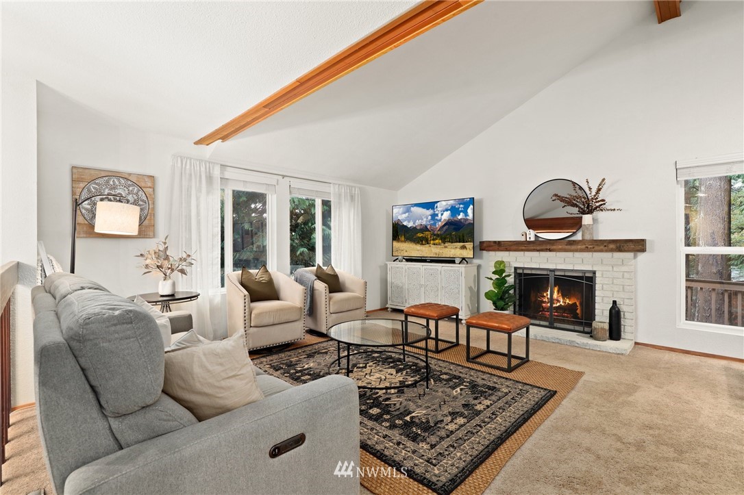 3305 199th Place Southeast Bothell, WA 98012 - Photo 3 of 39 a living room with furniture and a fireplace