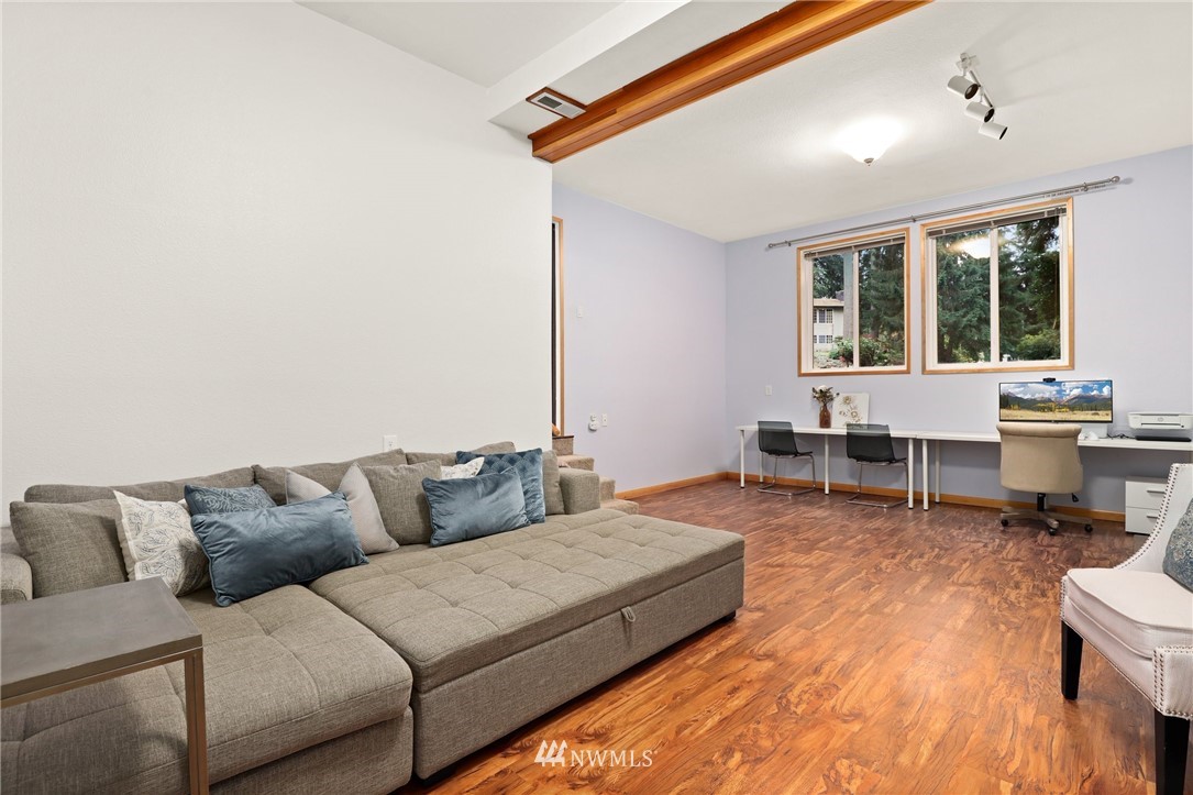 3305 199th Place Southeast Bothell, WA 98012 - Photo 22 of 39 a living room with furniture and wooden floor