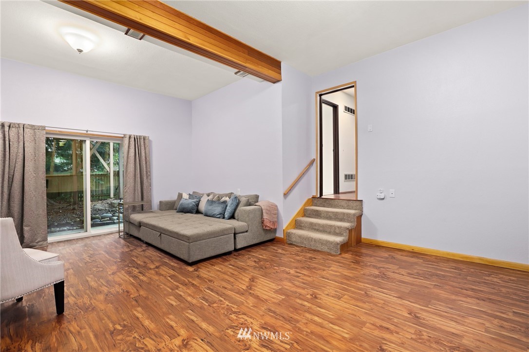 3305 199th Place Southeast Bothell, WA 98012 - Photo 24 of 39 a bedroom with a bed and a large window