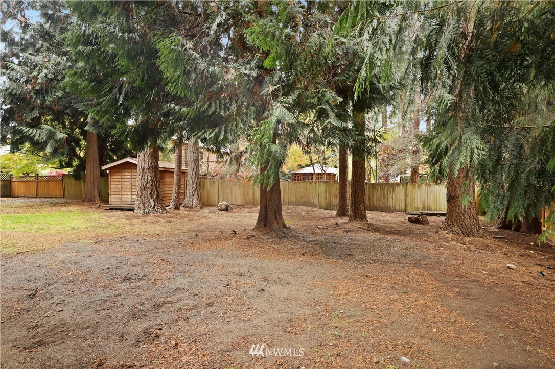 3305 199th Place Southeast Bothell, WA 98012 - Photo 30 of 39 a view of a yard with plants and trees
