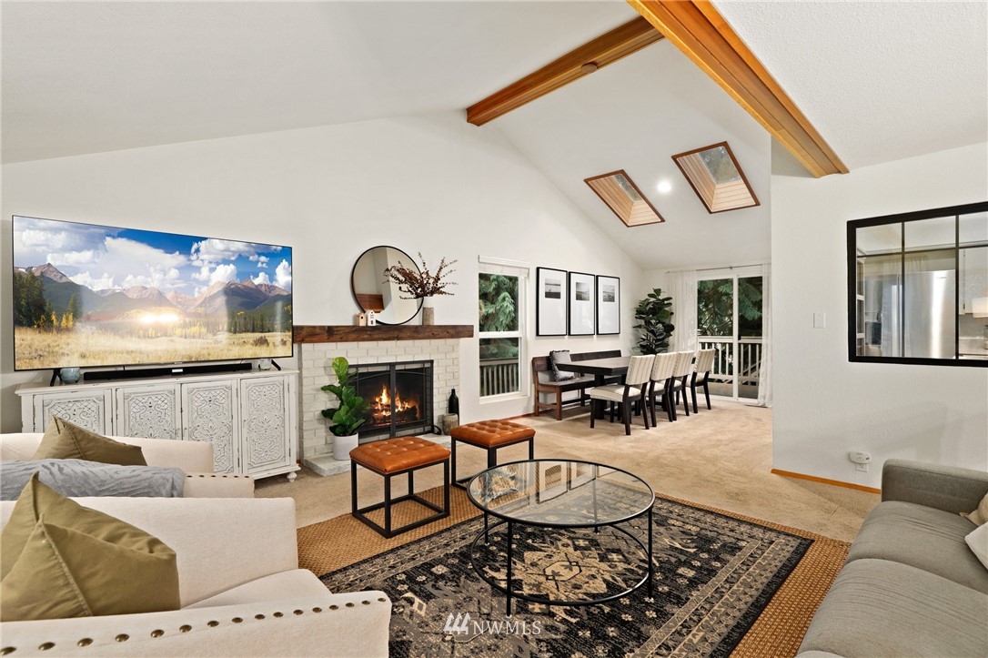 3305 199th Place Southeast Bothell, WA 98012 - Photo 4 of 39 a living room with furniture a rug and a fireplace