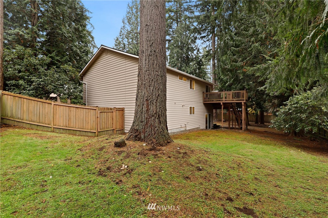 3305 199th Place Southeast Bothell, WA 98012 - Photo 33 of 39 a house with trees in the background