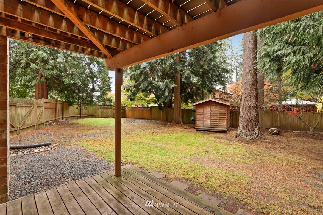 3305 199th Place Southeast Bothell, WA 98012 - Photo 34 of 39 a backyard of a house with table and chairs