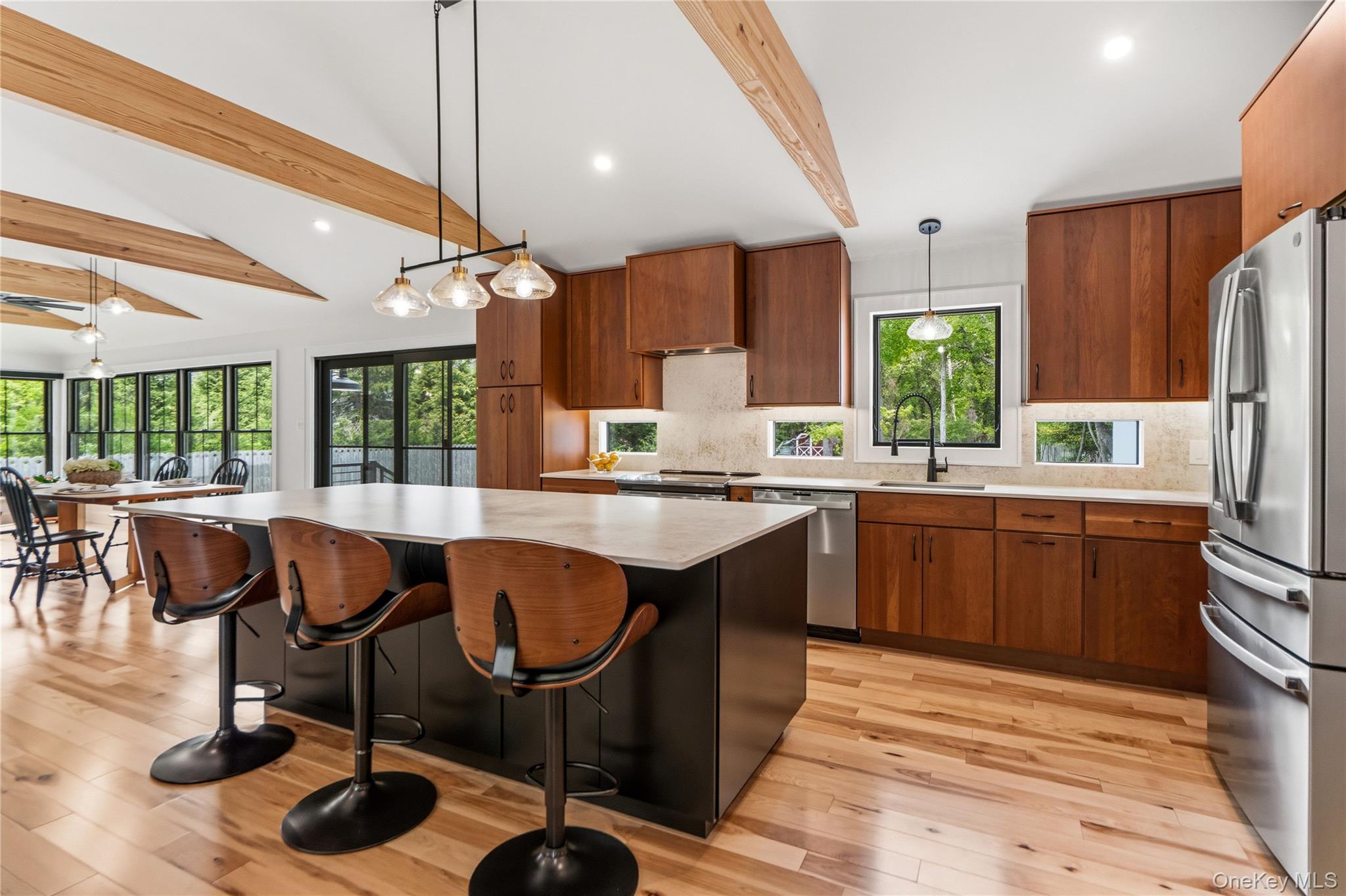 263 Beaver Dam Road Brookhaven, NY 11719 - Photo 8 of 32 a kitchen with a sink cabinets and dining table chair