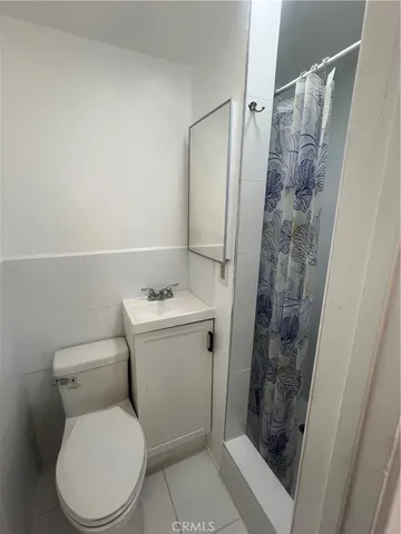 a bathroom with a toilet and a sink