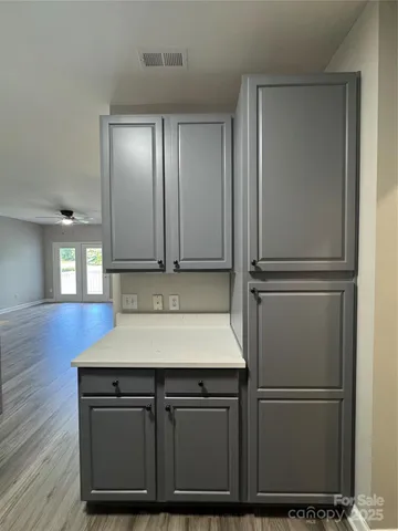 a kitchen with cabinets and stainless steel appliances