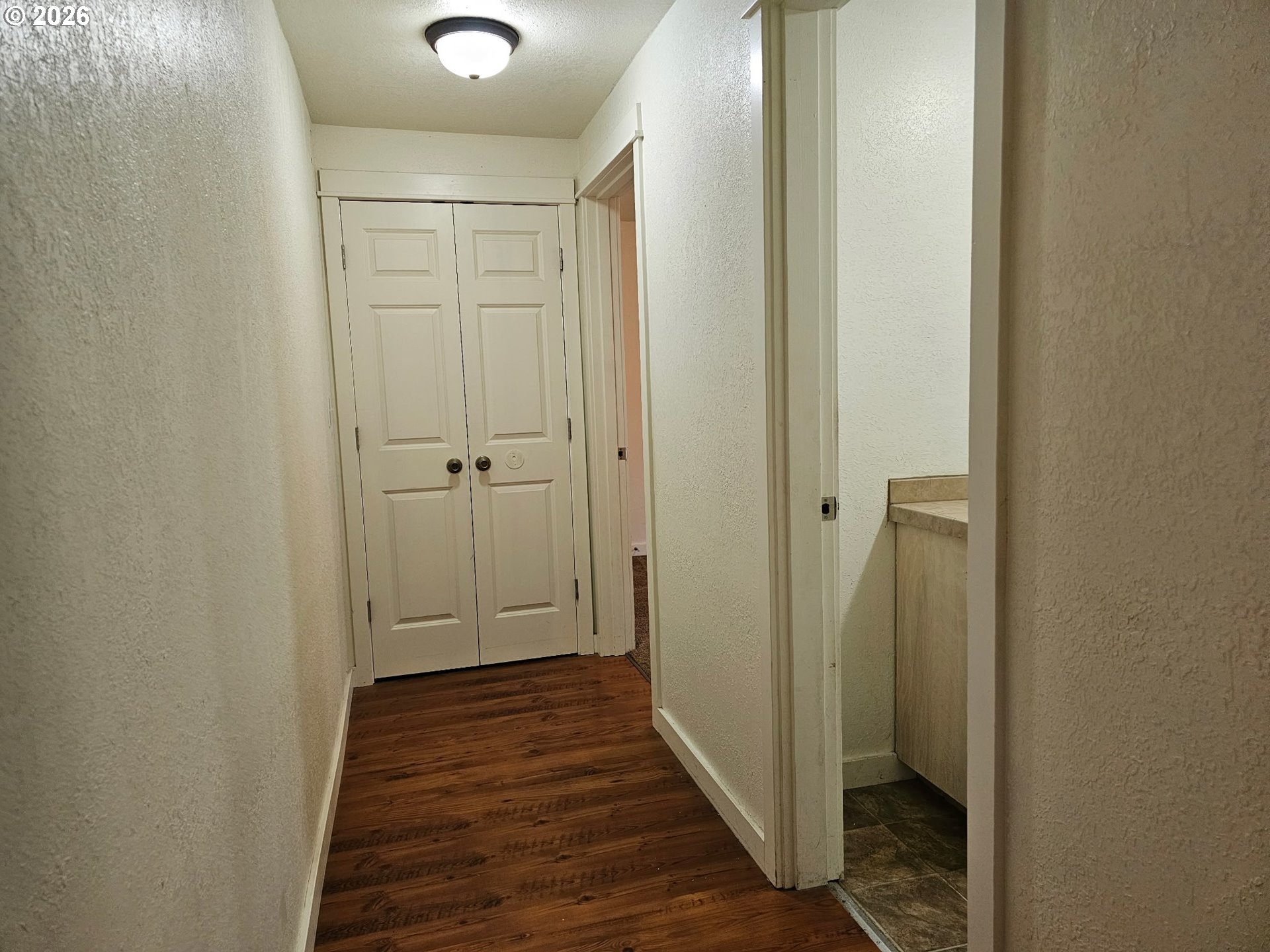 33802 Market Road Creswell, OR 97426 - Photo 9 of 30 a view of a hallway with wooden floor