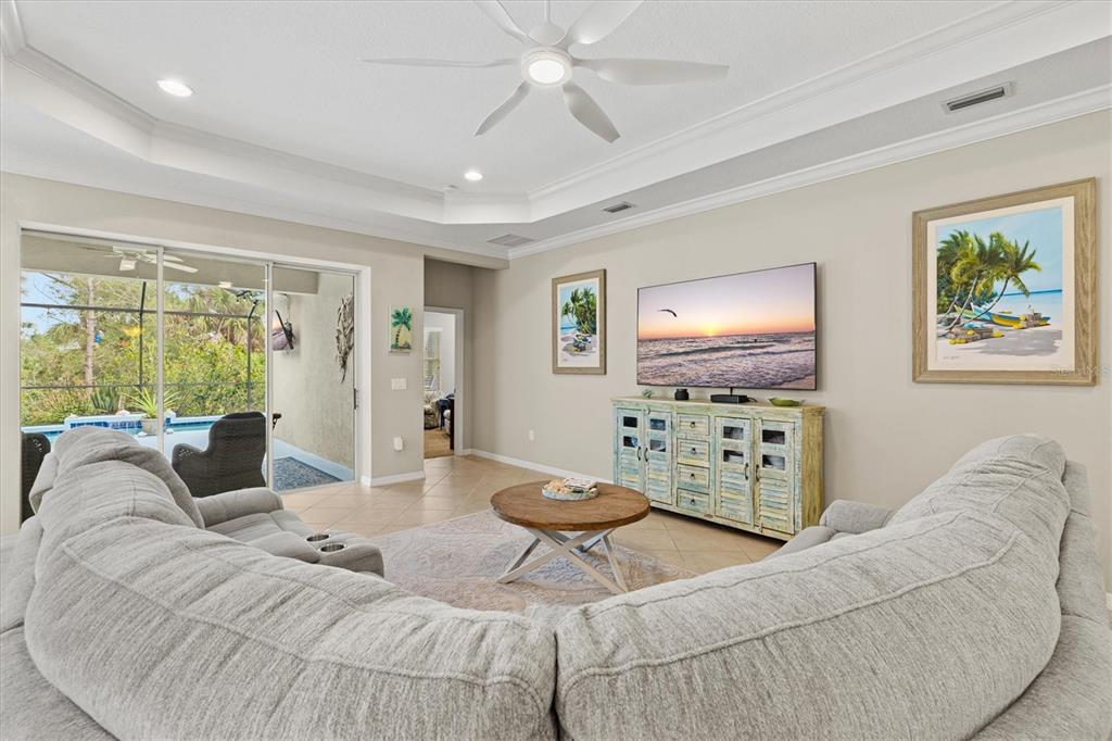 11610 Marathon Circle Venice, FL 34293 - Photo 12 of 84 a living room with furniture and a flat screen tv
