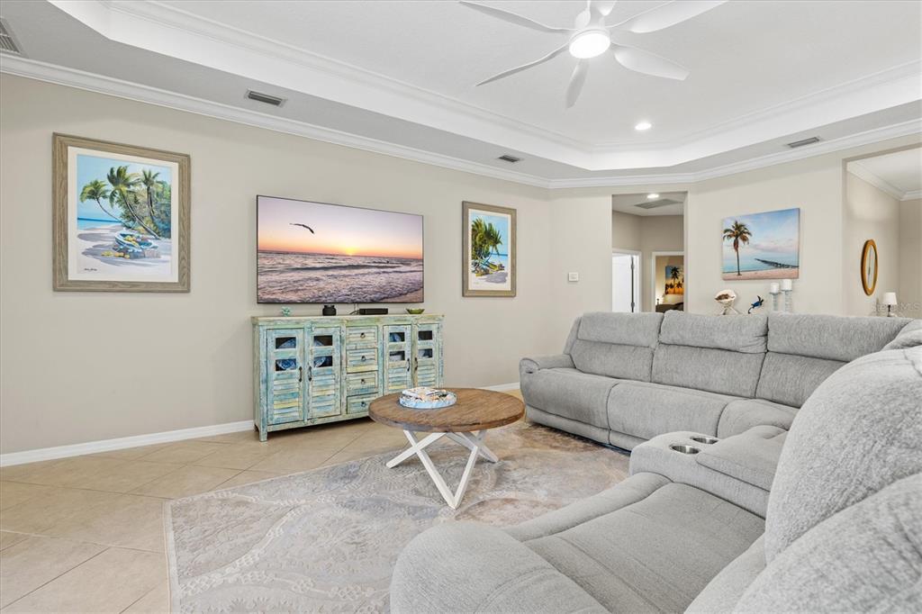 11610 Marathon Circle Venice, FL 34293 - Photo 27 of 84 a living room with furniture and a flat screen tv