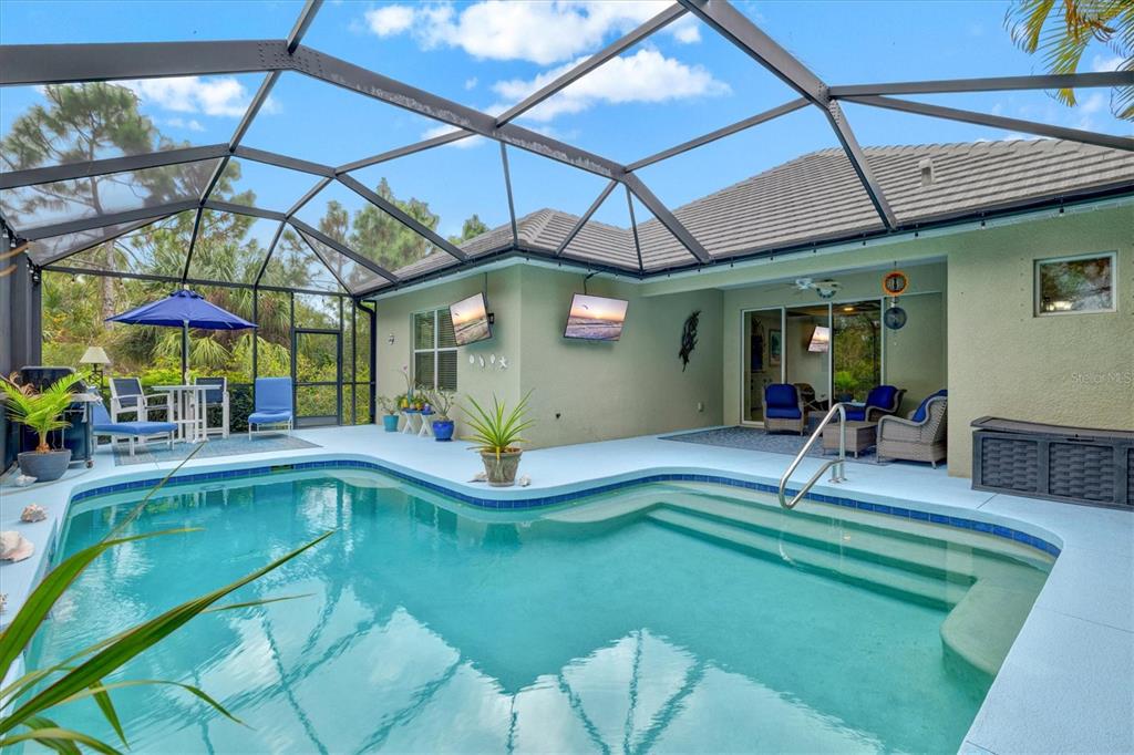 11610 Marathon Circle Venice, FL 34293 - Photo 3 of 84 a view of a swimming pool with a patio