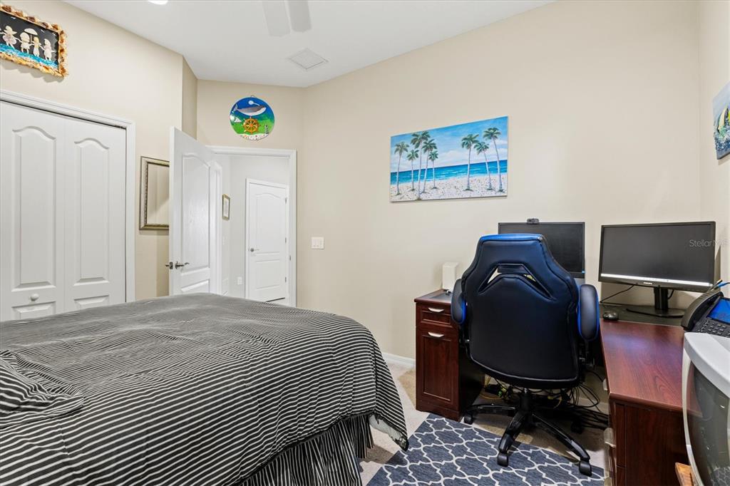 11610 Marathon Circle Venice, FL 34293 - Photo 35 of 84 a bedroom with a bed and a desk