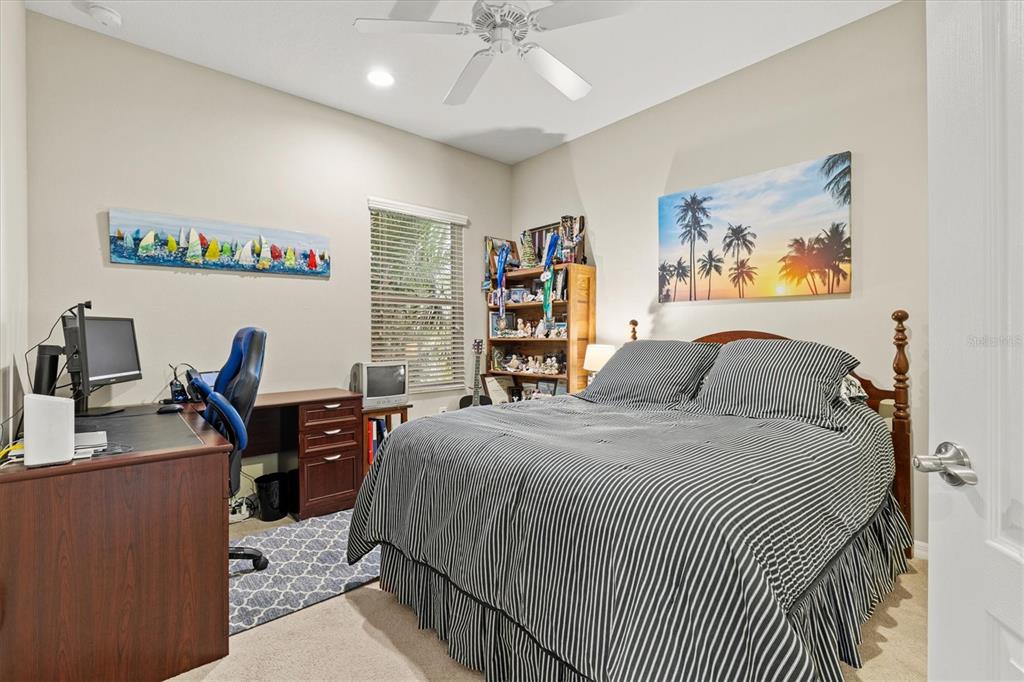 11610 Marathon Circle Venice, FL 34293 - Photo 36 of 84 a bedroom with a bed and a desk