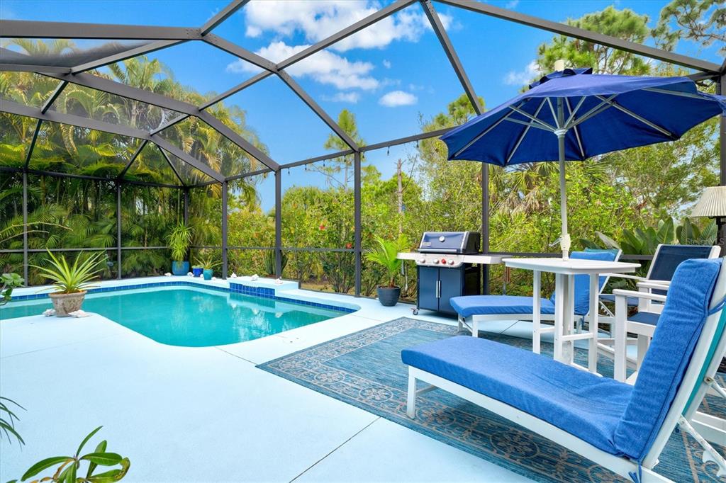 11610 Marathon Circle Venice, FL 34293 - Photo 4 of 84 a view of backyard with swimming pool and outdoor seating