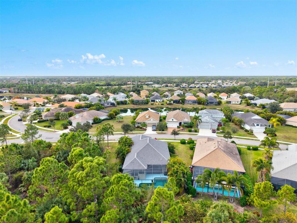 11610 Marathon Circle Venice, FL 34293 - Photo 48 of 84 an aerial view of residential houses with outdoor space and trees