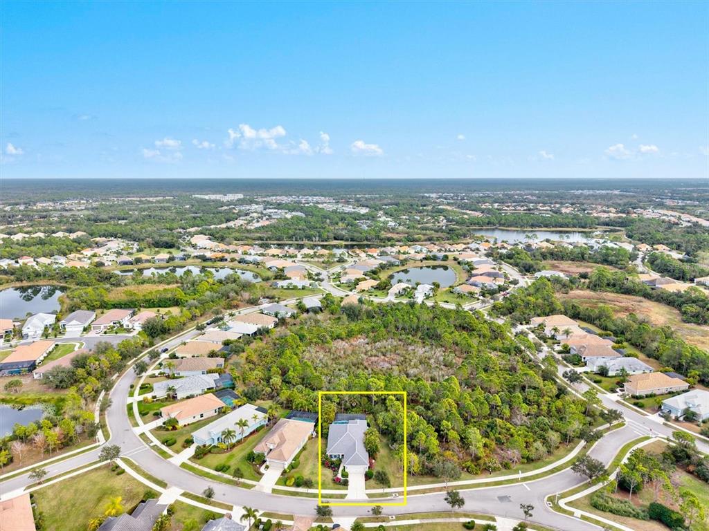 11610 Marathon Circle Venice, FL 34293 - Photo 49 of 84 an aerial view of residential houses with outdoor space