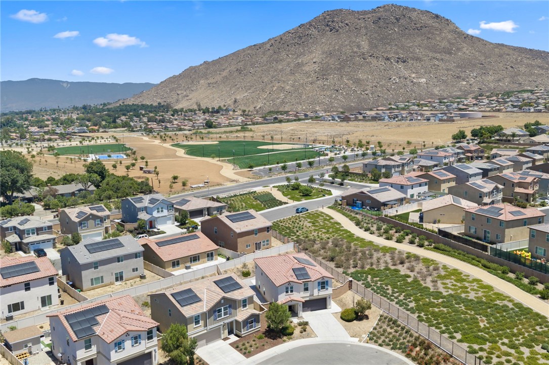 20130 Curaco Court Riverside, CA 92507 - Photo 42 of 43 Aerial view of the park with sports fields, walking paths, and recreation areas.