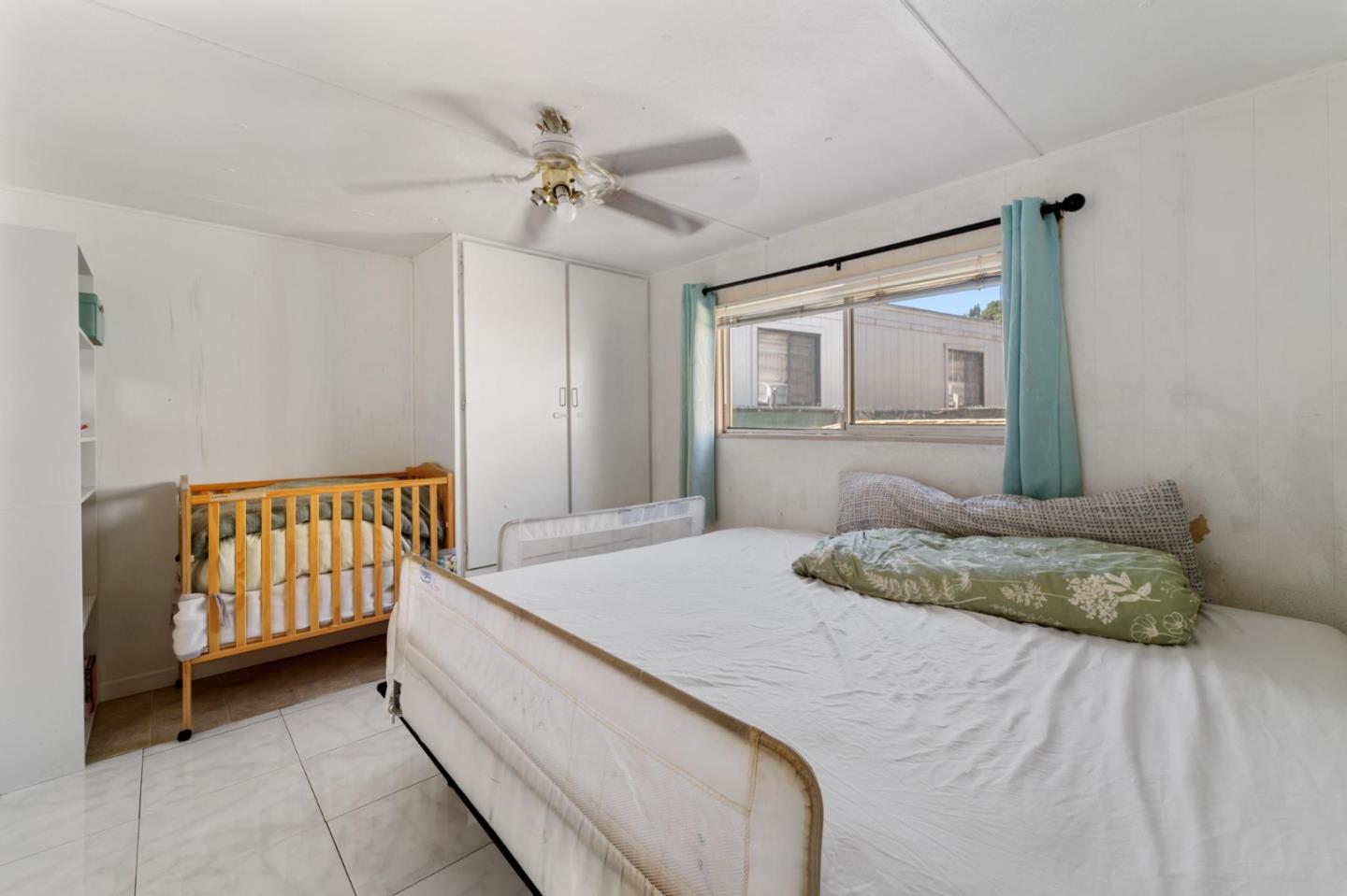 4320 Monterey Road, Unit 39 San Jose, CA 95111 - Photo 11 of 17 a bedroom with a bed and a dresser