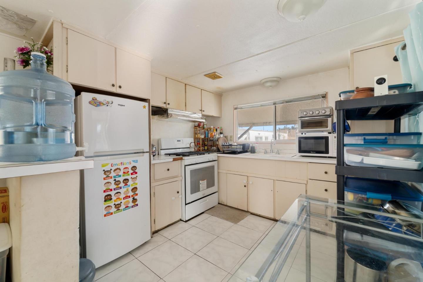 4320 Monterey Road, Unit 39 San Jose, CA 95111 - Photo 4 of 17 a kitchen with refrigerator and cabinets