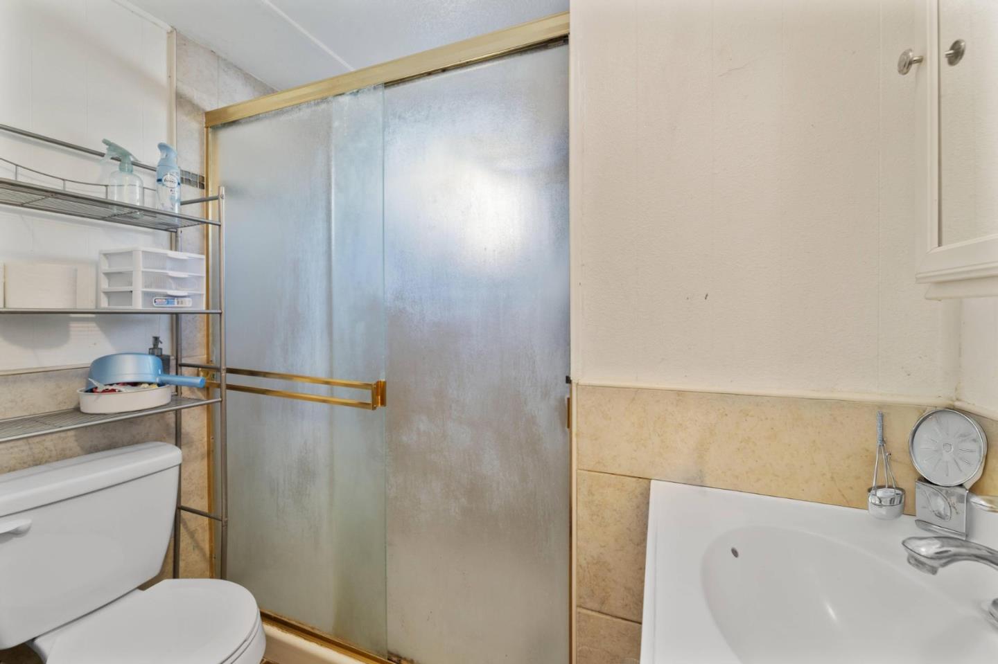 4320 Monterey Road, Unit 39 San Jose, CA 95111 - Photo 10 of 17 a bathroom with a sink a toilet and shower