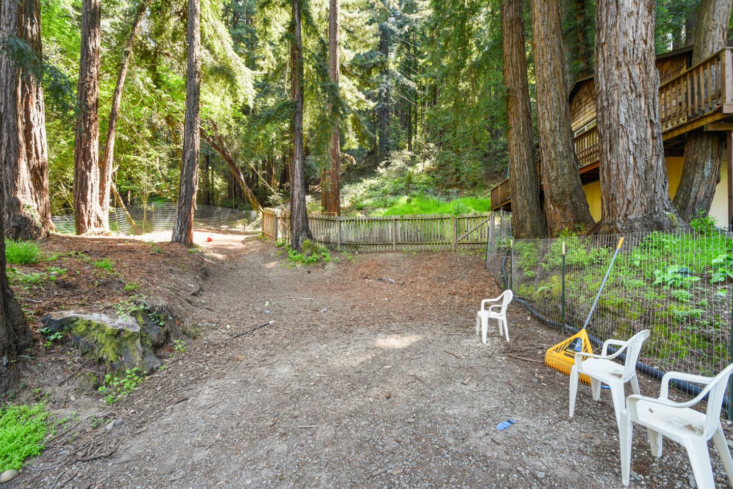 17550 Comanche Trail Los Gatos, CA 95033 - Photo 15 of 15 a backyard of a house with table and chairs