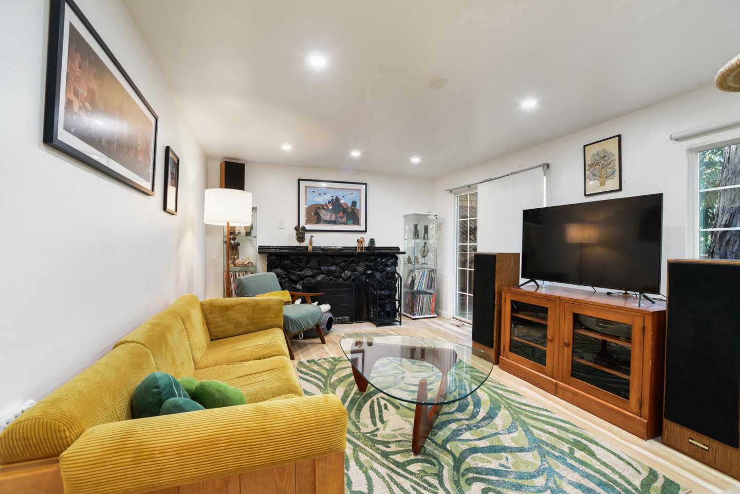17550 Comanche Trail Los Gatos, CA 95033 - Photo 2 of 15 a living room with furniture and a flat screen tv