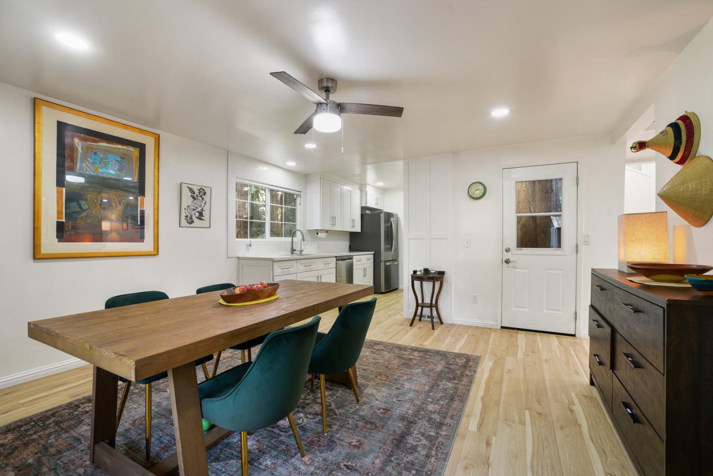 17550 Comanche Trail Los Gatos, CA 95033 - Photo 5 of 15 a dining hall with stainless steel appliances granite countertop a stove a sink a dining table and chairs with wooden floor