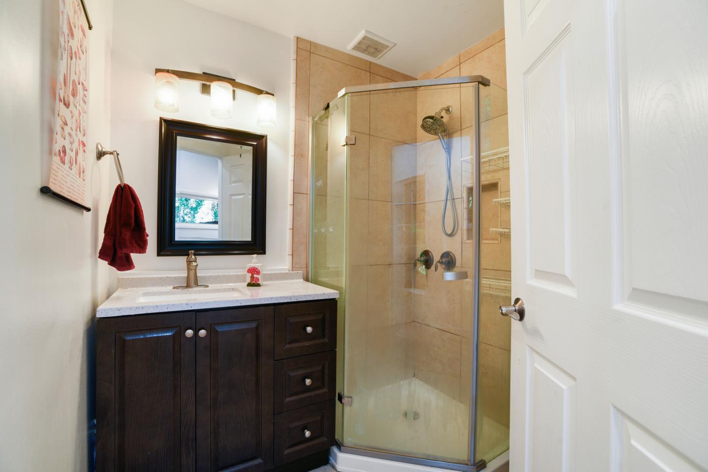 17550 Comanche Trail Los Gatos, CA 95033 - Photo 9 of 15 a bathroom with a double vanity sink mirror and shower