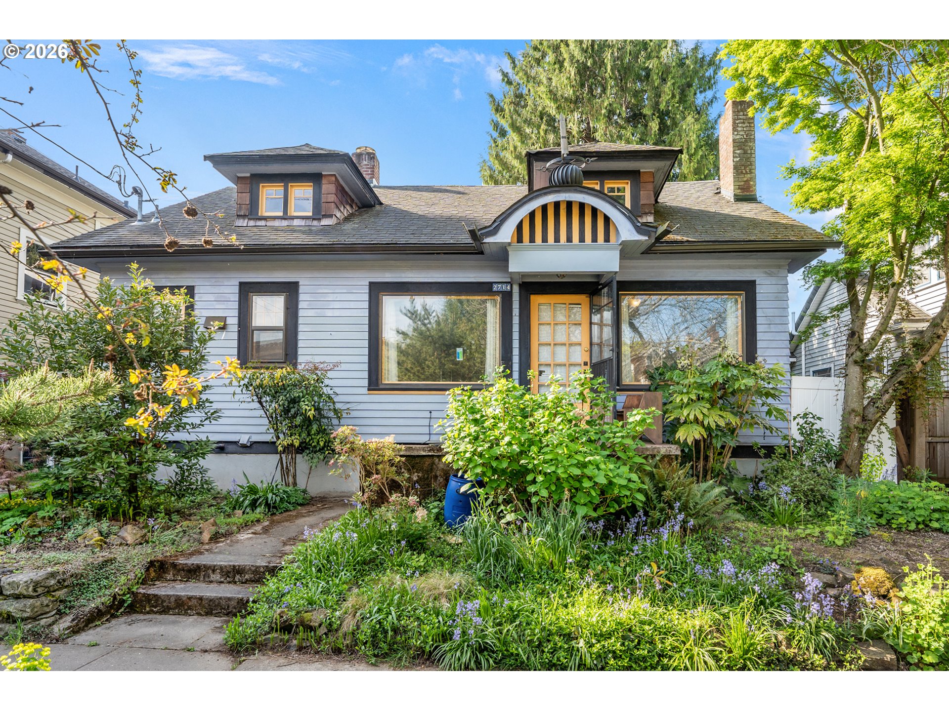 2714 Northeast Everett Street Portland, OR 97232 - Photo 1 of 6 a front view of a house with garden