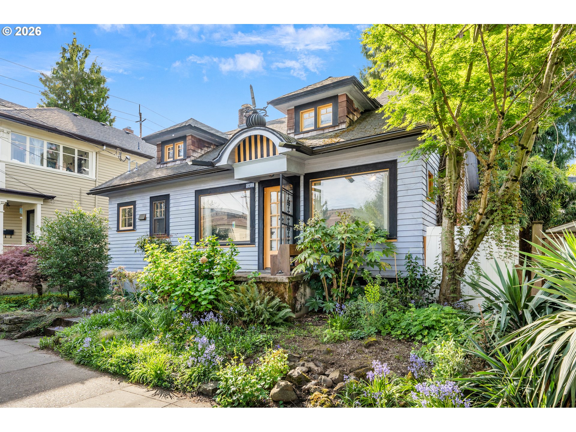 2714 Northeast Everett Street Portland, OR 97232 - Photo 2 of 6 a front view of a house with garden