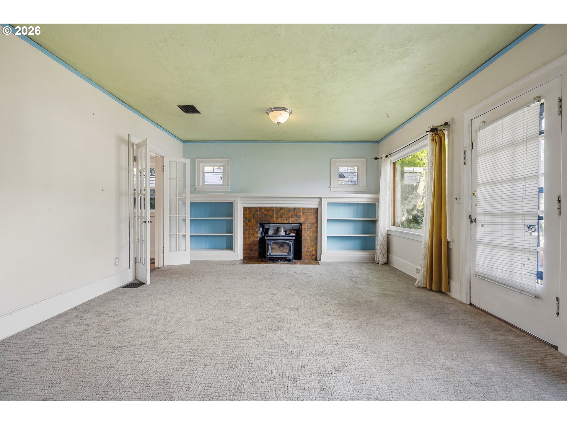 2714 Northeast Everett Street Portland, OR 97232 - Photo 5 of 6 a view of empty room with a fireplace