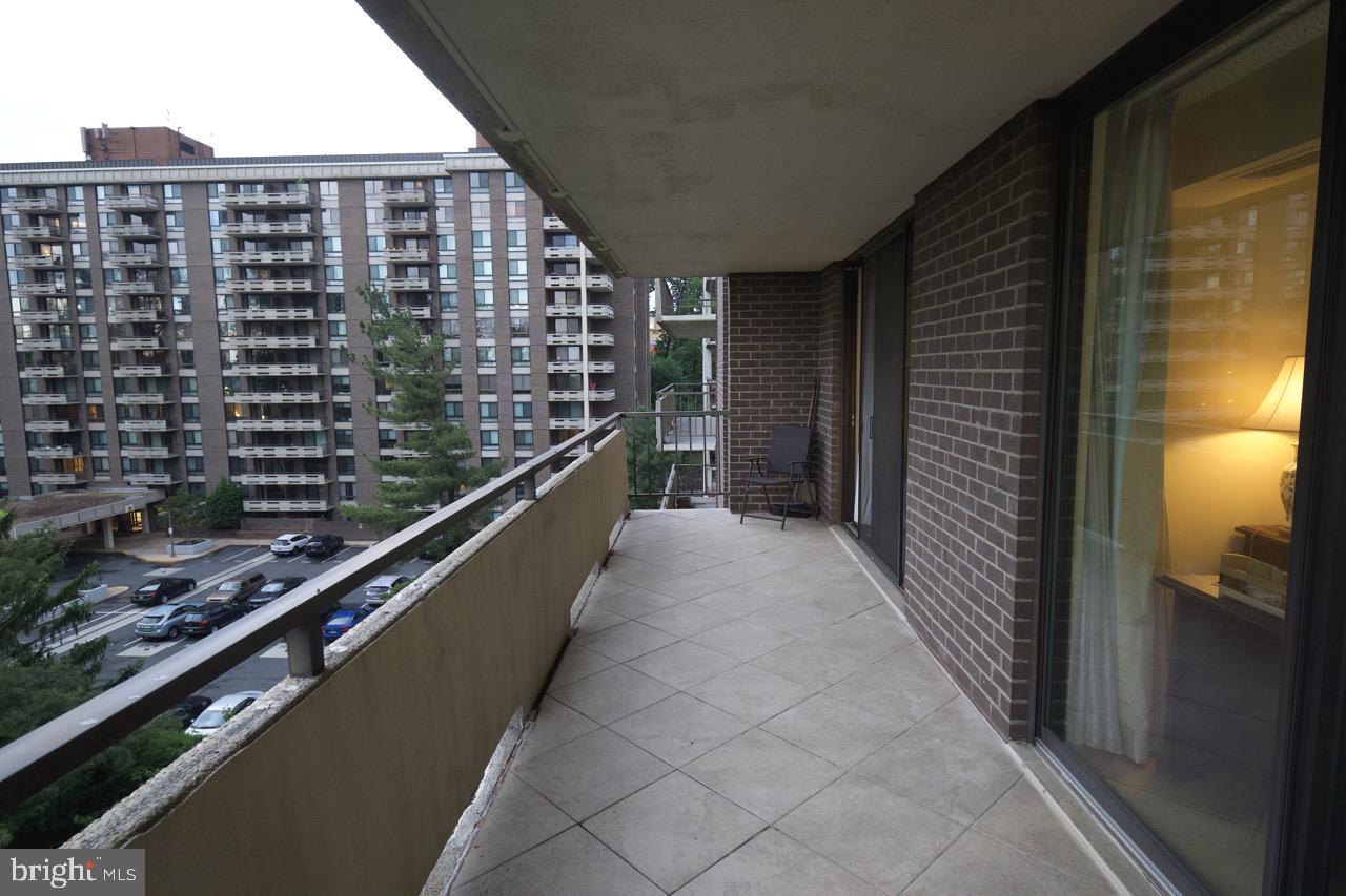 1800 Old Meadow Road, Unit 818 McLean, VA 22102 - Photo 27 of 35 a view of balcony with a couple of cars parked on road