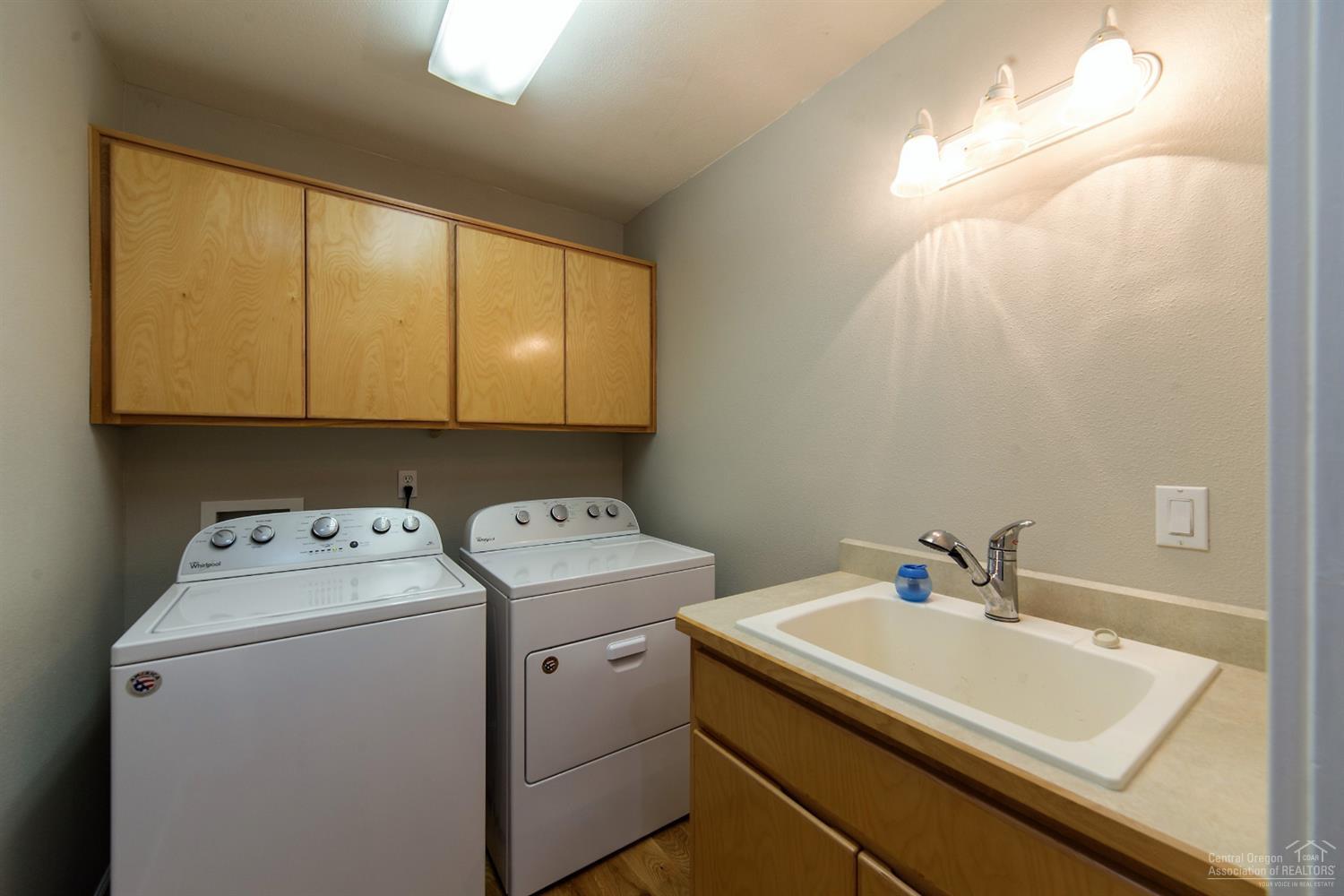 17325 Covina Road Bend, OR 97707 - Photo 20 of 25 Roomy laundry with utility sink and lots