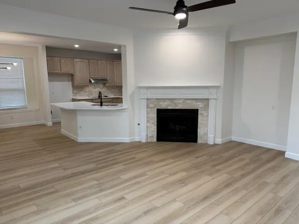 a kitchen with kitchen island a sink and wooden cabinets