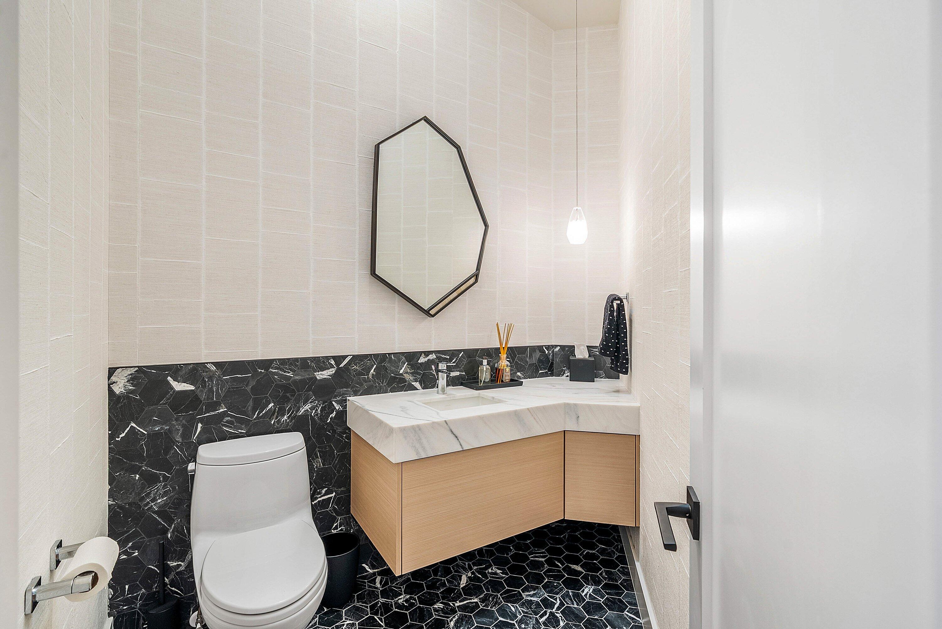 5798 Northwest 21st Avenue Boca Raton, FL 33496 - Photo 20 of 52 a bathroom with a sink toilet and a mirror