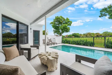 a balcony with furniture and garden view