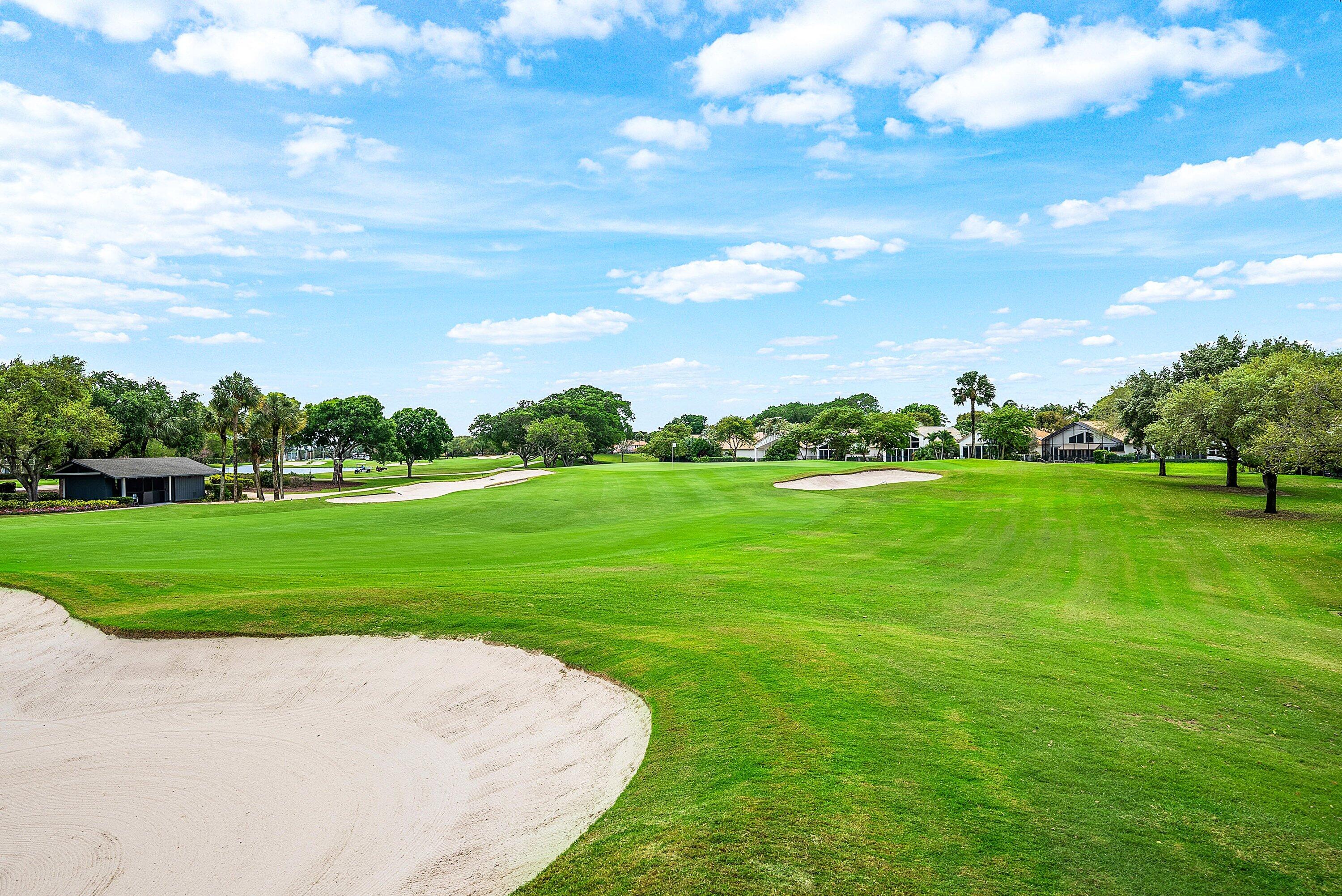 5798 Northwest 21st Avenue Boca Raton, FL 33496 - Photo 29 of 52 a view of grassy field with grass and trees