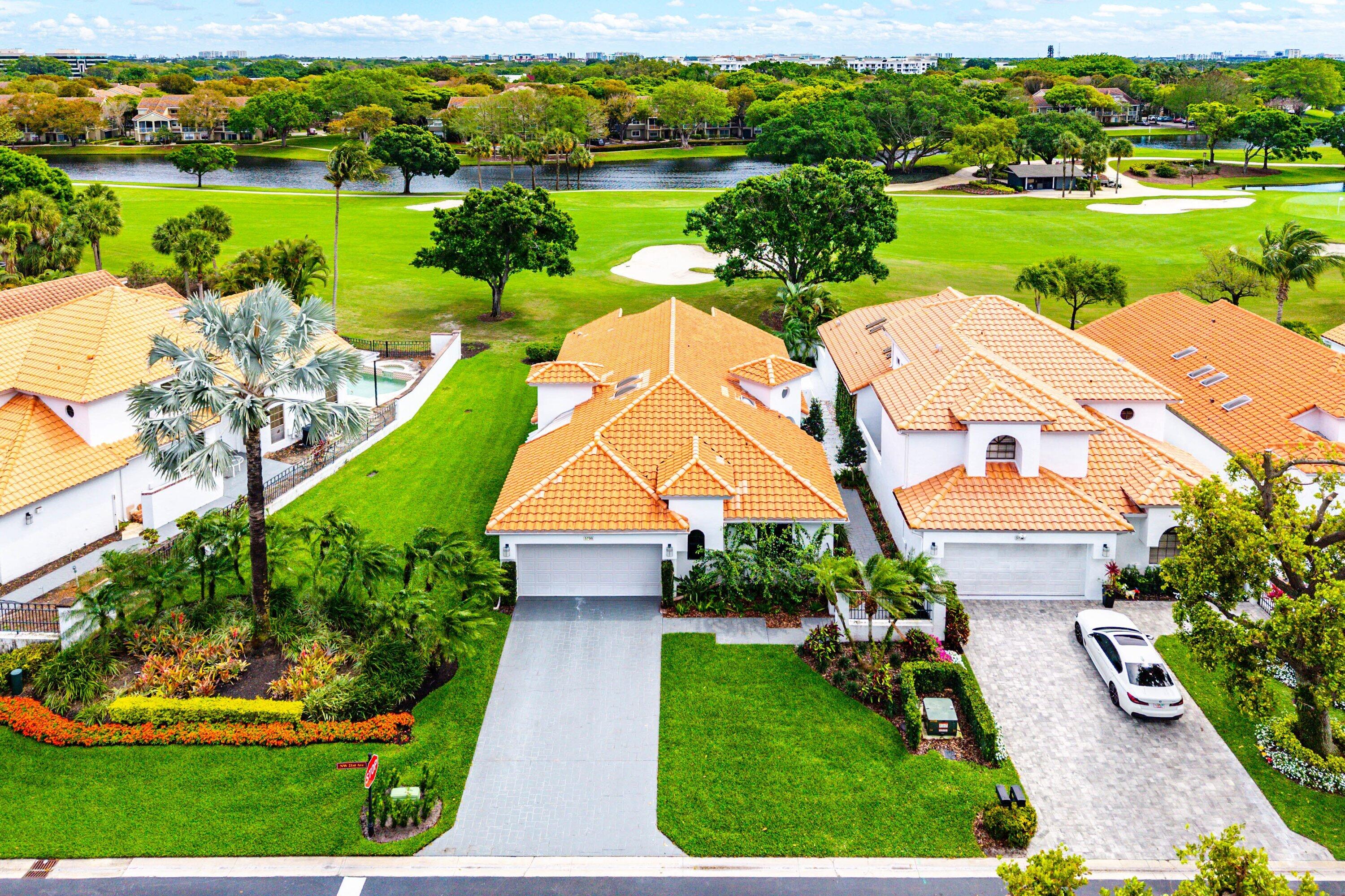 5798 Northwest 21st Avenue Boca Raton, FL 33496 - Photo 30 of 52 a aerial view of a house with big yard and large trees