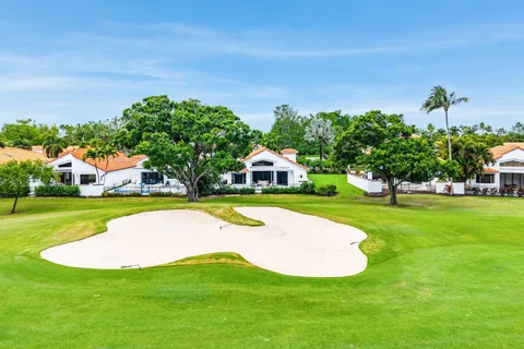 a view of a house with a swimming pool yard and green space