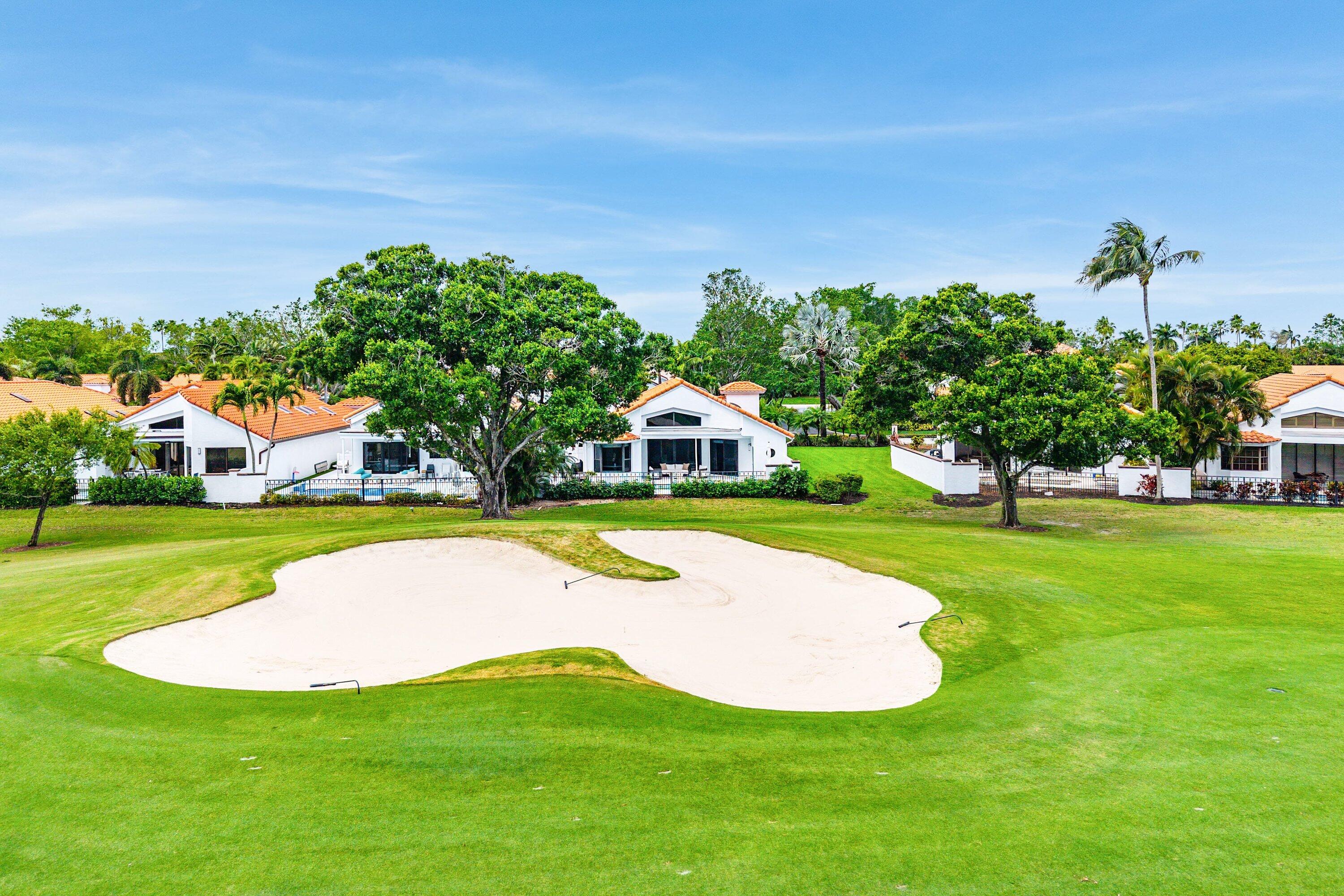 5798 Northwest 21st Avenue Boca Raton, FL 33496 - Photo 33 of 52 a view of a house with a swimming pool yard and green space