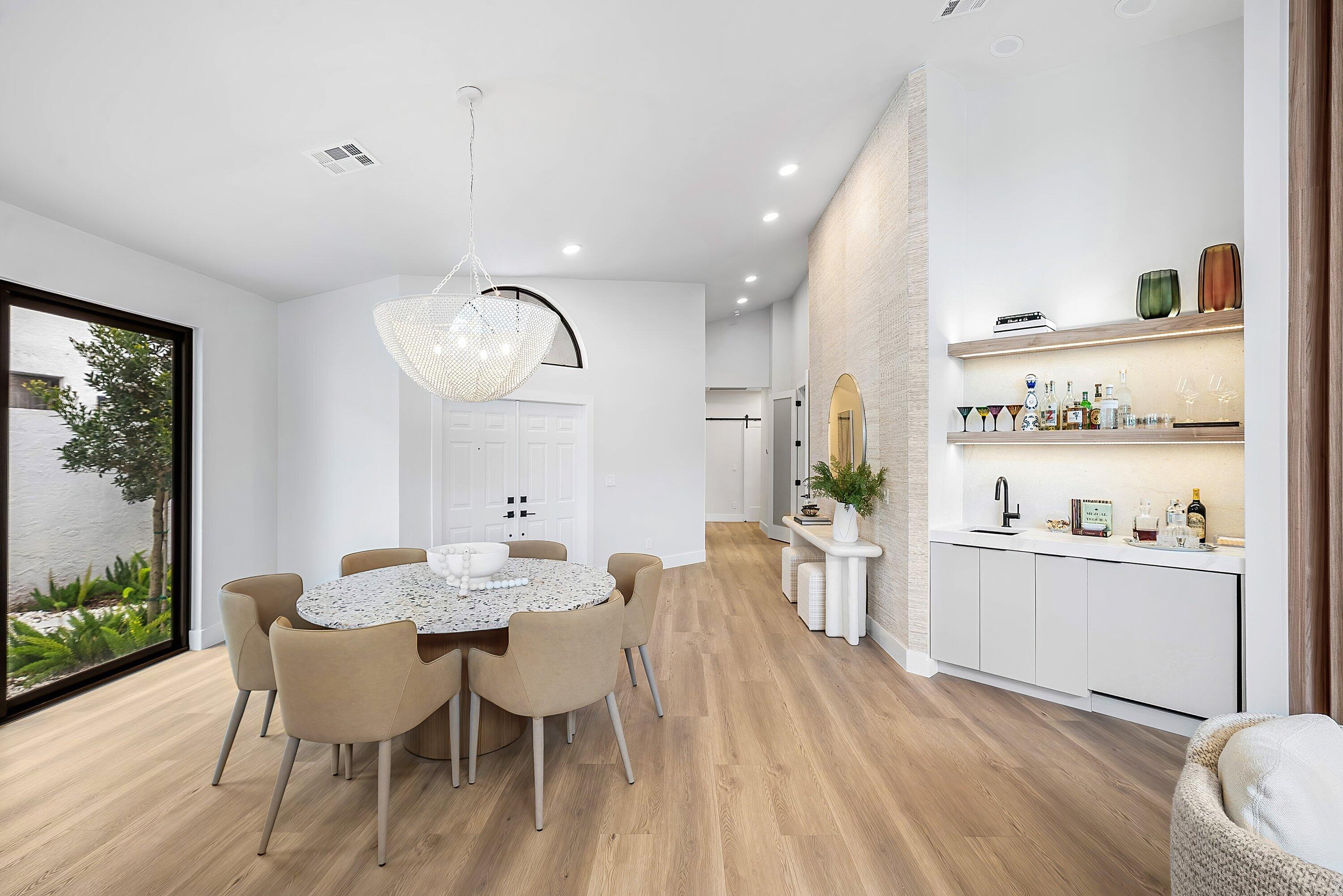 5798 Northwest 21st Avenue Boca Raton, FL 33496 - Photo 5 of 52 a view of a dining room with furniture window and wooden floor