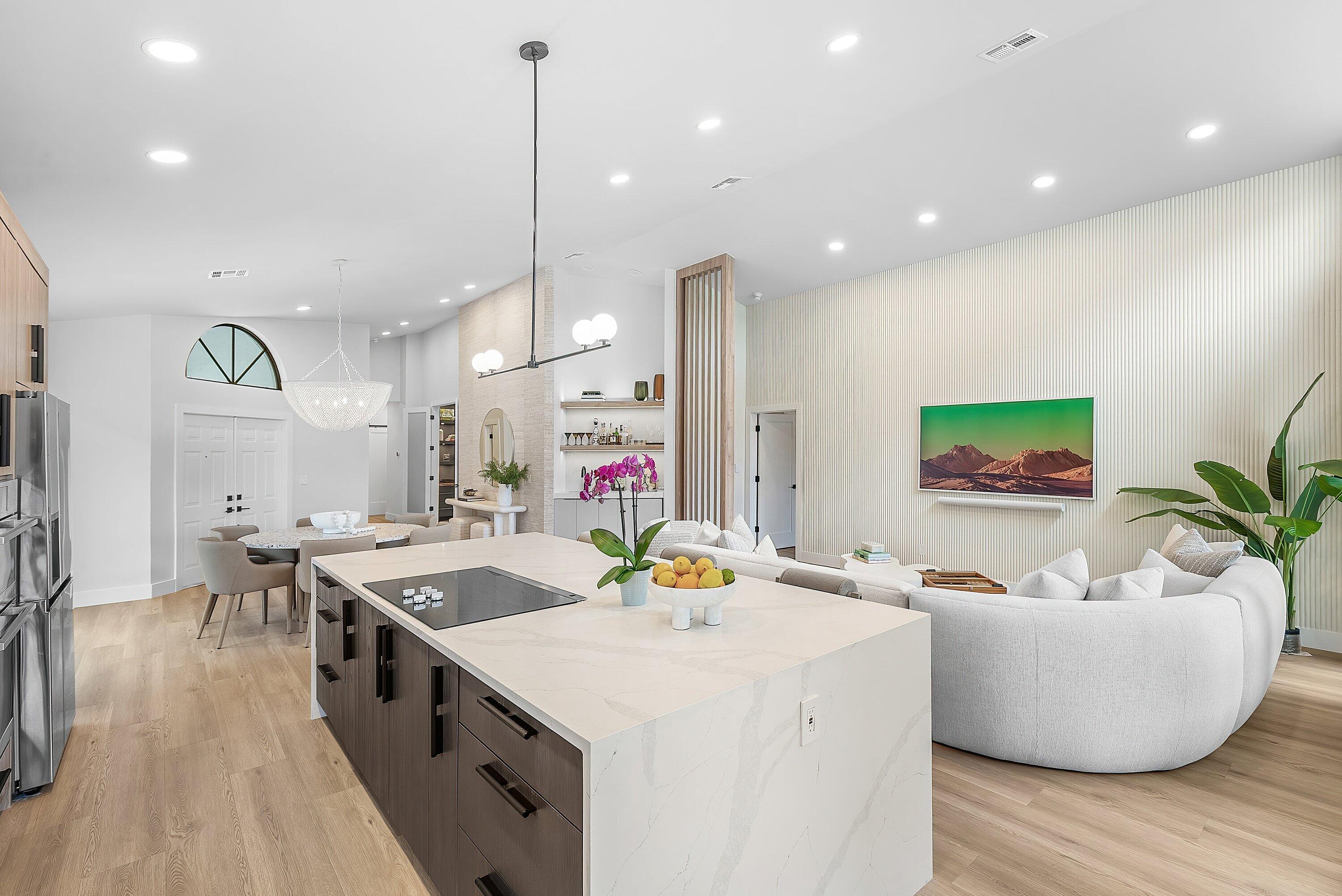 5798 Northwest 21st Avenue Boca Raton, FL 33496 - Photo 9 of 52 a very nice looking living room with a dining table chairs and a potted plant