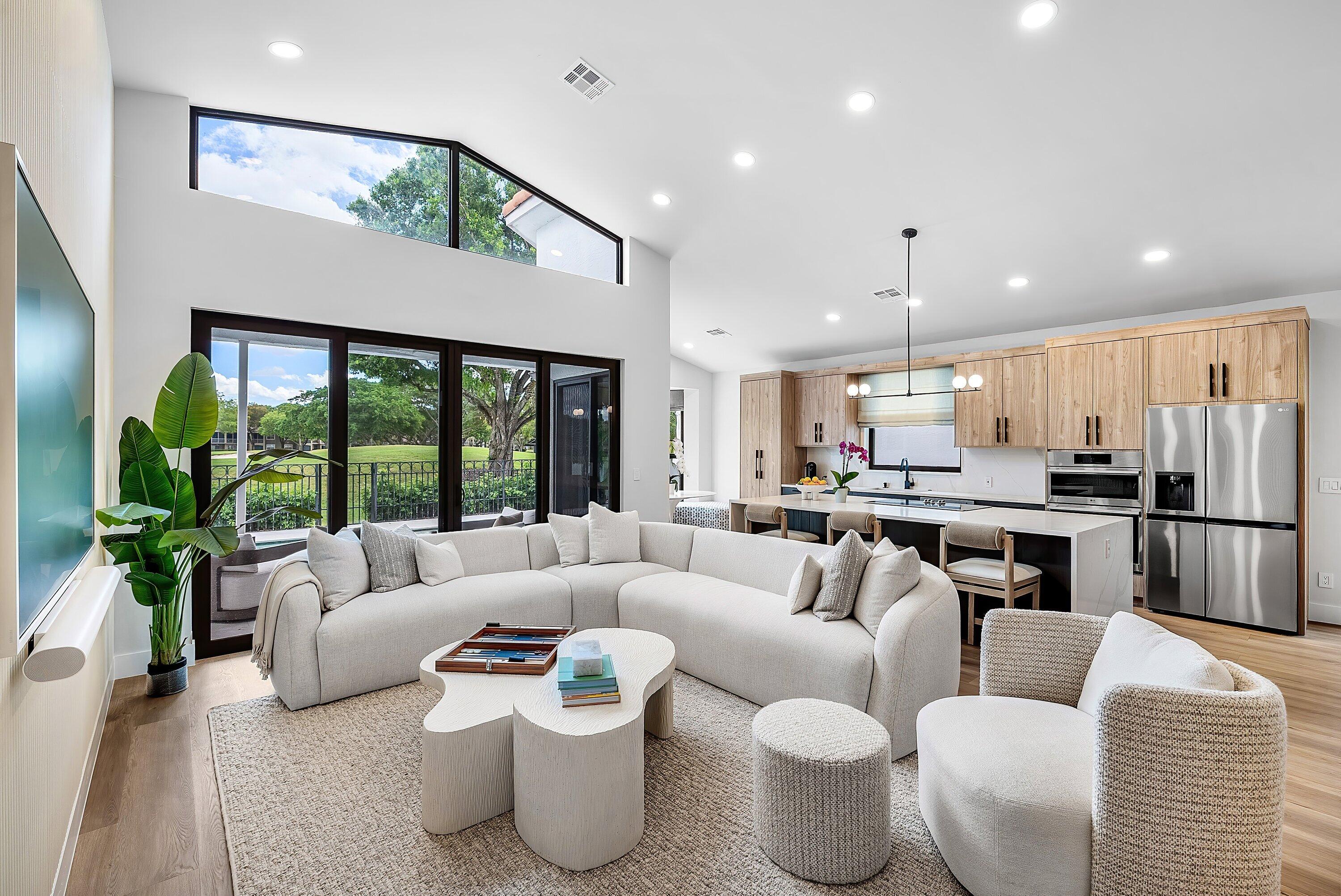 5798 Northwest 21st Avenue Boca Raton, FL 33496 - Photo 10 of 52 a living room with furniture and a large window