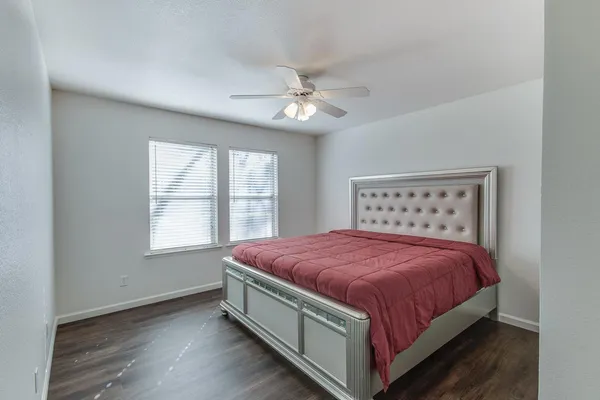 a bedroom with a bed and window