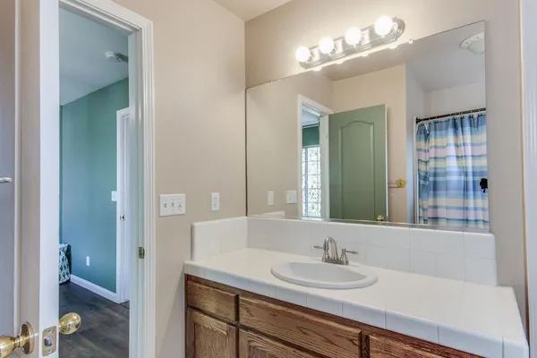 a bathroom with a sink and a mirror