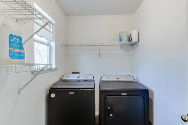 a utility room with dryer and washer
