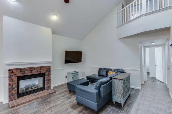 a living room with furniture and a fireplace