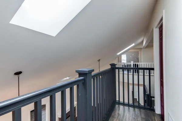 a view of a hallway with windows
