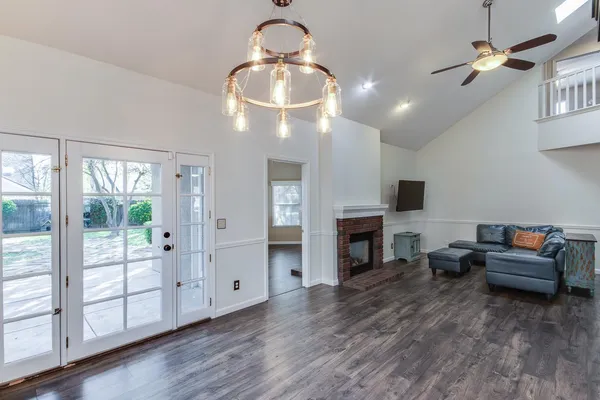 a living room with furniture fireplace and flat screen tv