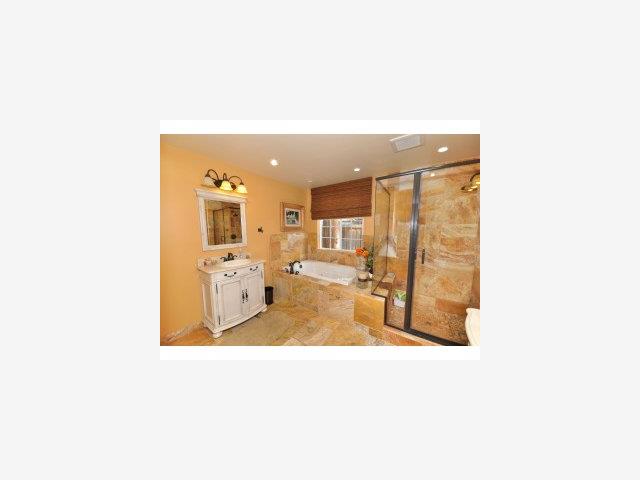 1095 Riverside Drive Los Altos, CA 94024 - Photo 3 of 9 a bathroom with a sink mirror and a bath tub