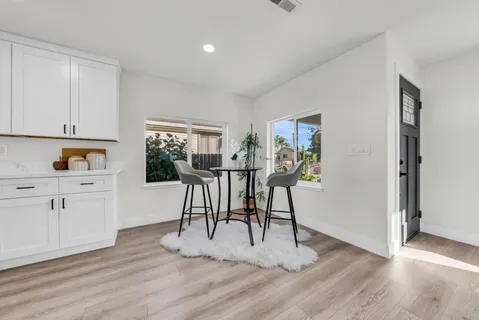 a view of a dining room with furniture window and outside view